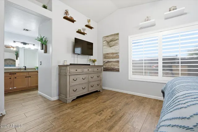 a bedroom with a bed and window