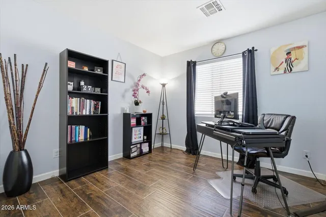 a bathroom with a granite countertop sink a mirror and shower