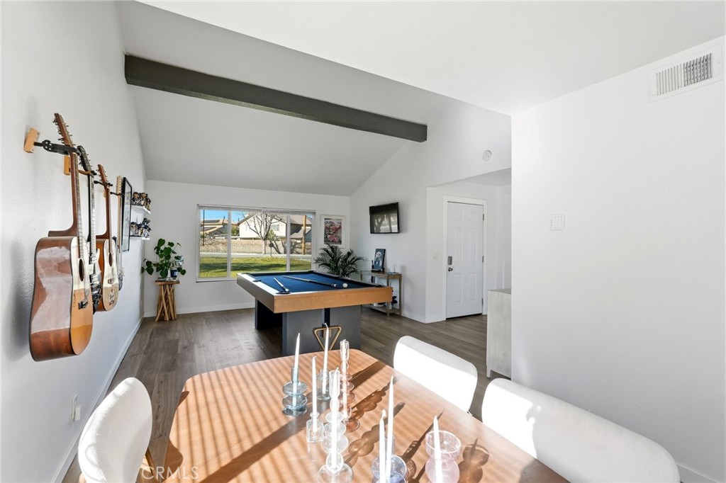 41428 50th Street West Lancaster, CA 93536 - Photo 12 of 46 a living room with furniture a rug and a table