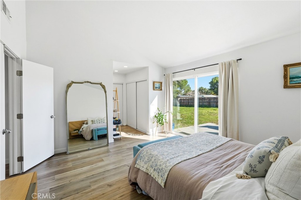 41428 50th Street West Lancaster, CA 93536 - Photo 17 of 46 a bed sitting in a spacious bedroom next to a window