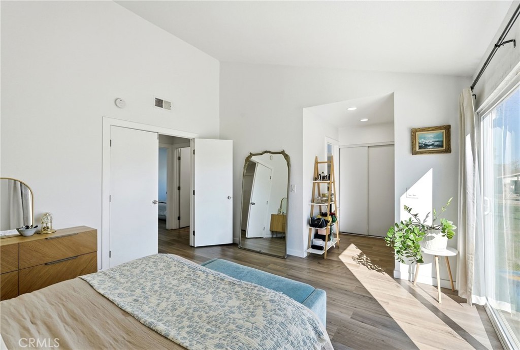 41428 50th Street West Lancaster, CA 93536 - Photo 18 of 46 a bedroom with a bed and a large mirror