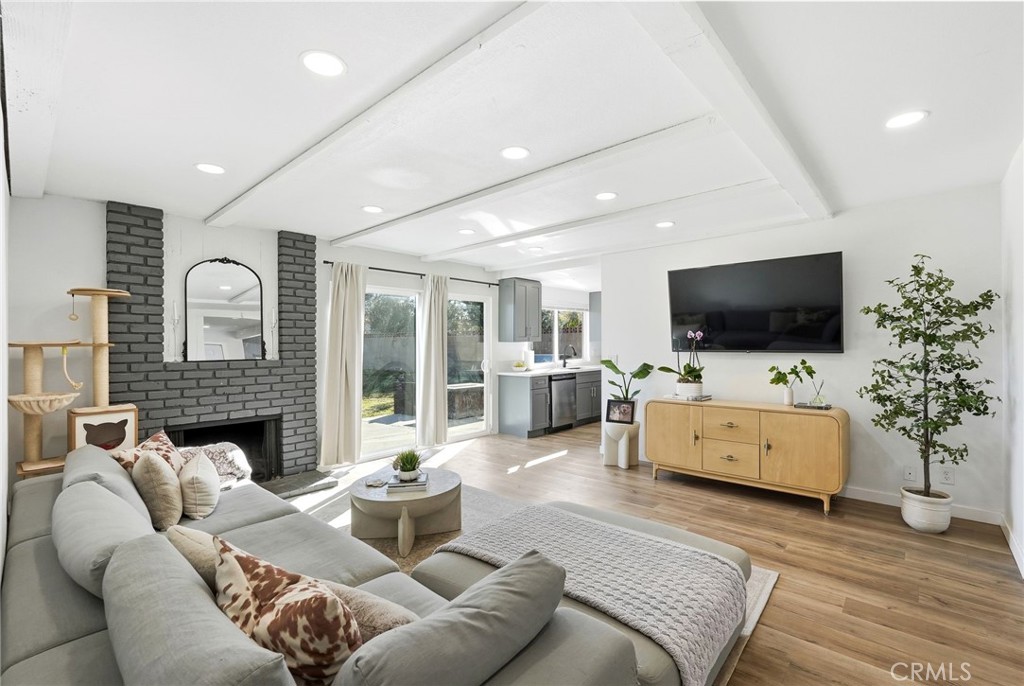 41428 50th Street West Lancaster, CA 93536 - Photo 3 of 46 a living room with furniture and a flat screen tv