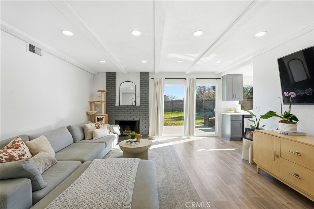 41428 50th Street West Lancaster, CA 93536 - Photo 5 of 46 a living room with fireplace furniture and a flat screen tv