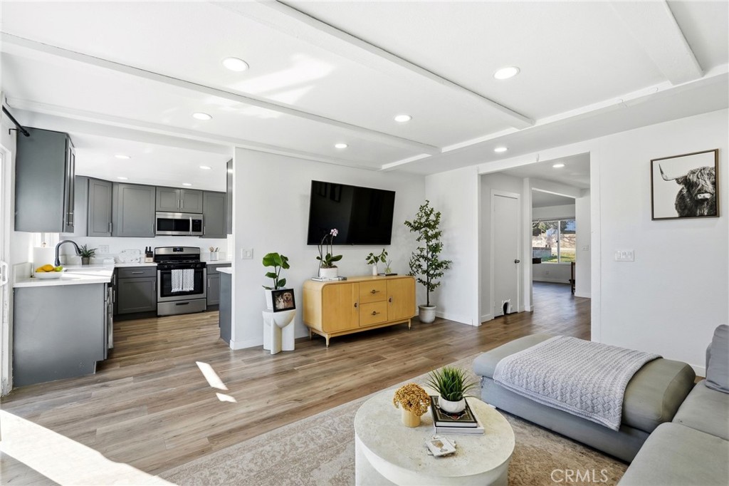 41428 50th Street West Lancaster, CA 93536 - Photo 7 of 46 a living room with furniture and a flat screen tv