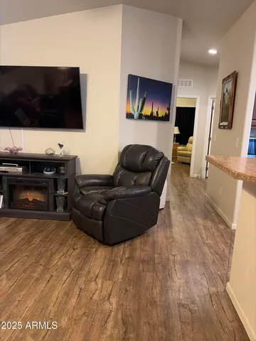 a kitchen with granite countertop a stove top oven and cabinets