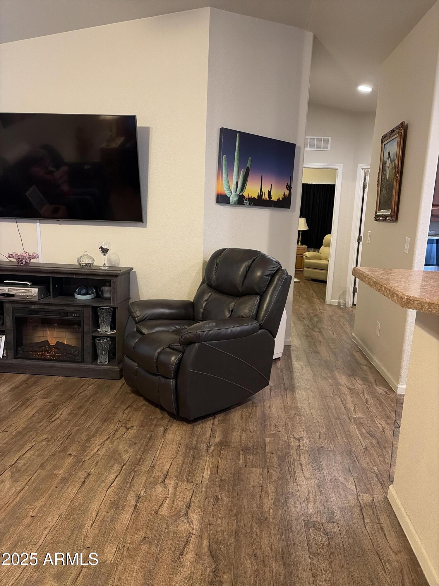 2929 East Main Street, Unit 43 Mesa, AZ 85213 - Photo 11 of 36 a living room with furniture and a flat screen tv