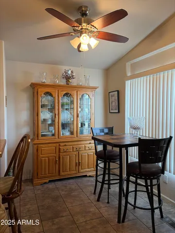 a view of a dining room with furniture window and outside view