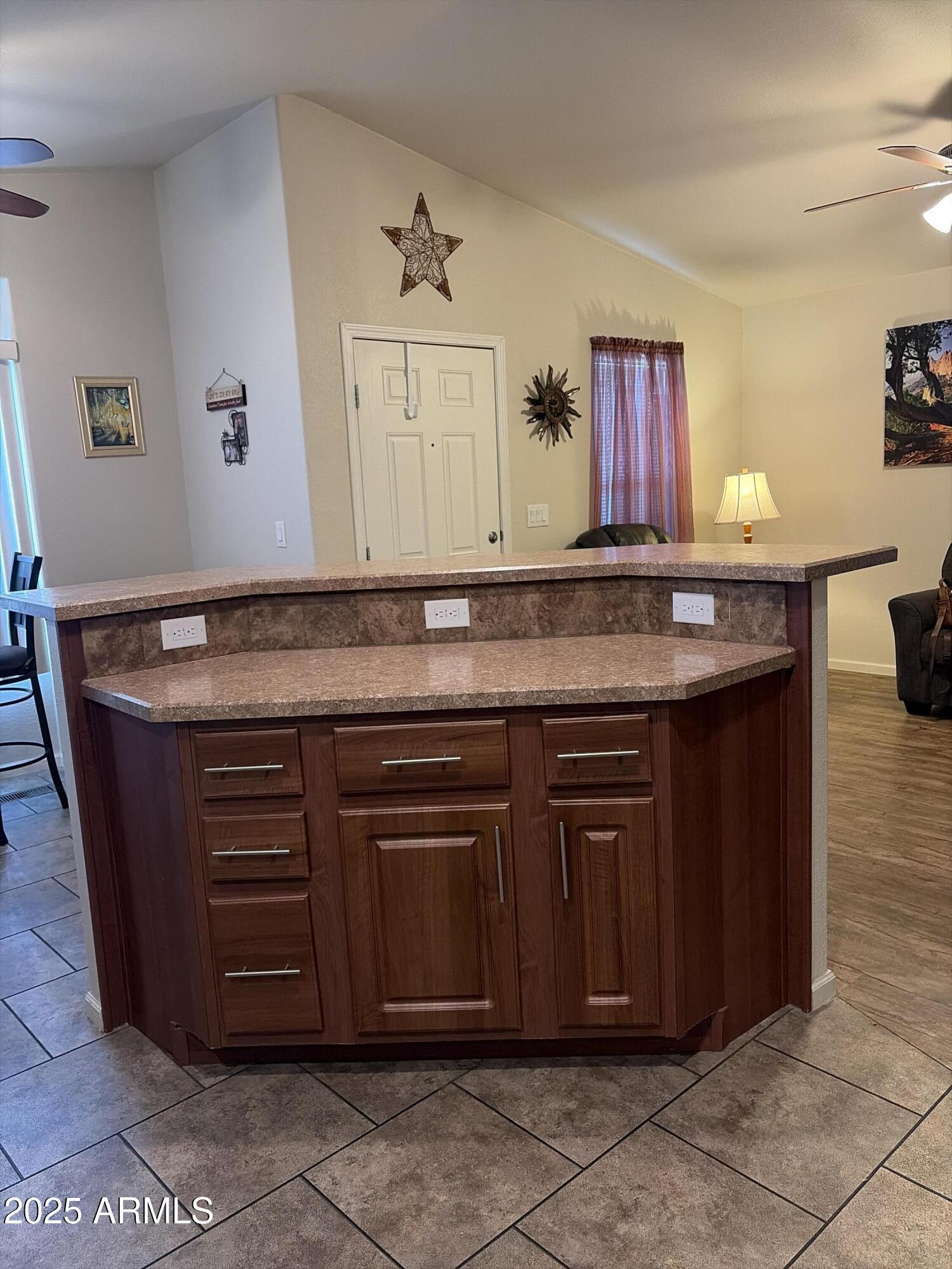2929 East Main Street, Unit 43 Mesa, AZ 85213 - Photo 19 of 36 a kitchen with granite countertop a sink and cabinets