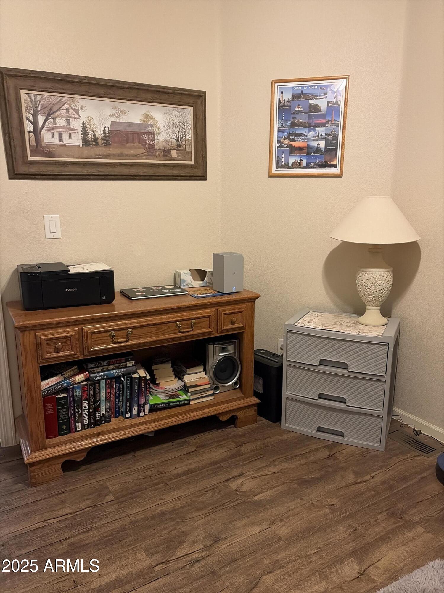 2929 East Main Street, Unit 43 Mesa, AZ 85213 - Photo 25 of 36 a living room with furniture and paintings on the wall