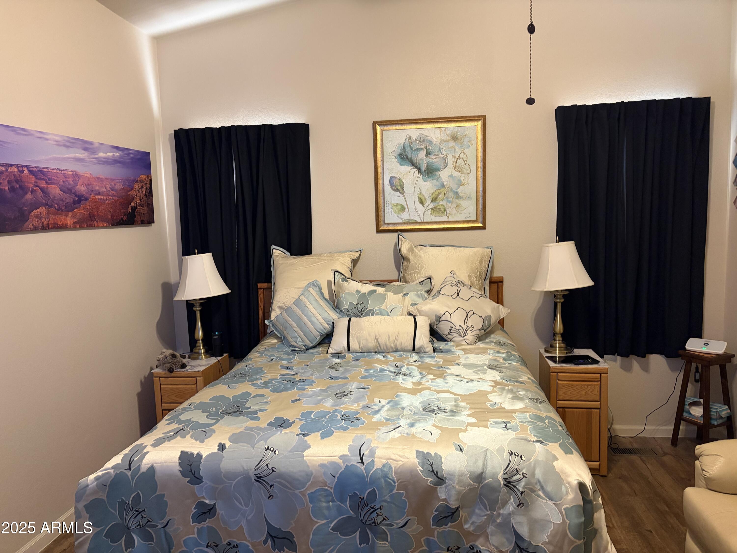 2929 East Main Street, Unit 43 Mesa, AZ 85213 - Photo 26 of 36 a bedroom with bed and wooden floor