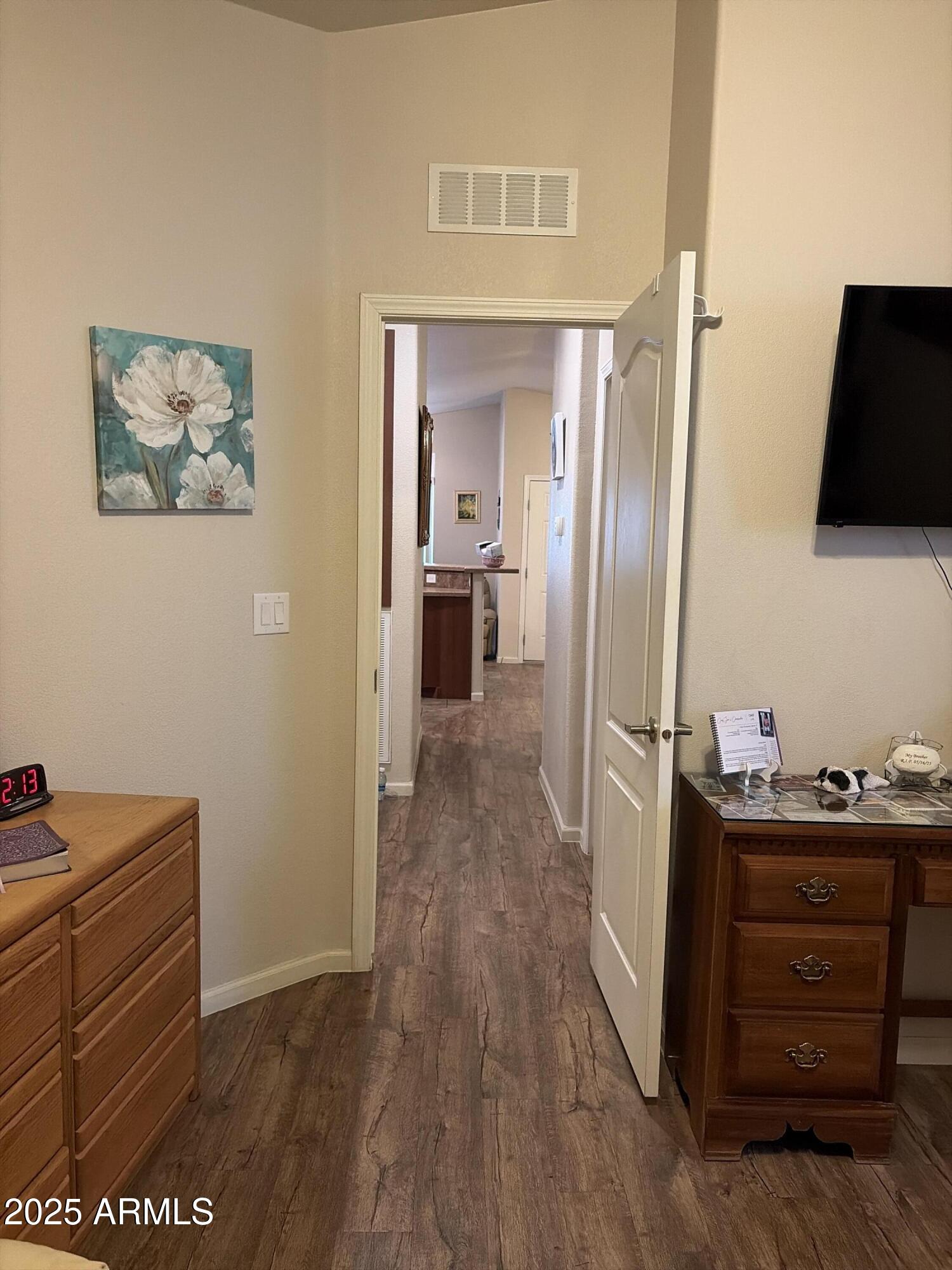2929 East Main Street, Unit 43 Mesa, AZ 85213 - Photo 30 of 36 a view of a hallway to a livingroom with wooden floor