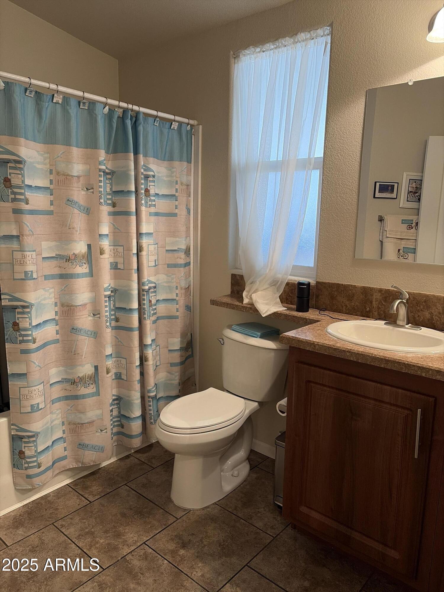 2929 East Main Street, Unit 43 Mesa, AZ 85213 - Photo 31 of 36 a bathroom with a sink toilet and shower
