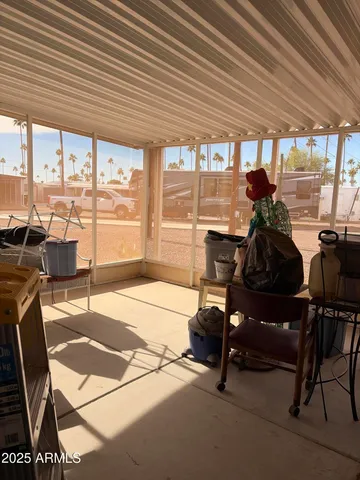 a bedroom with furniture and a window
