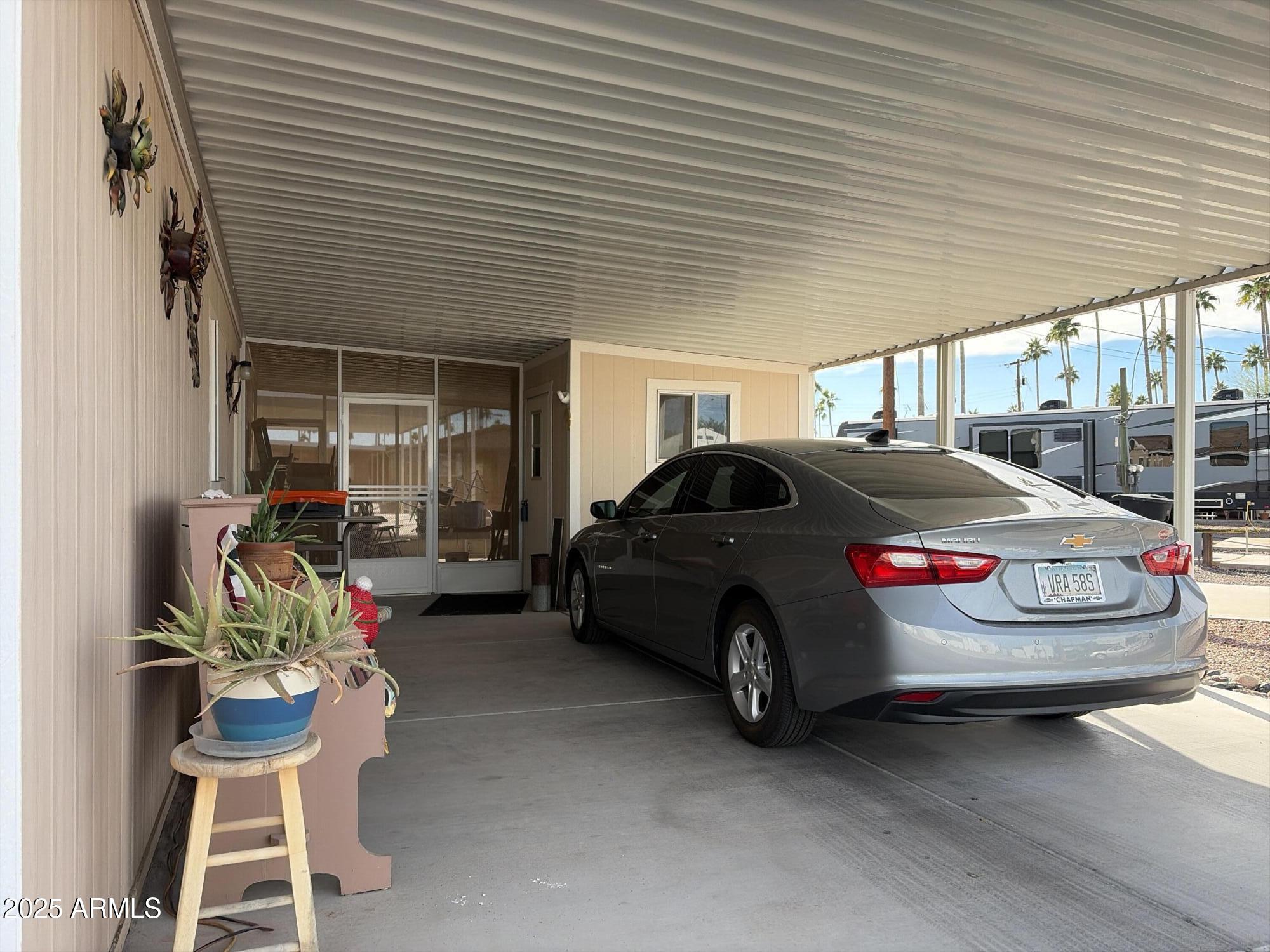 2929 East Main Street, Unit 43 Mesa, AZ 85213 - Photo 4 of 36 a car parked in front of a house