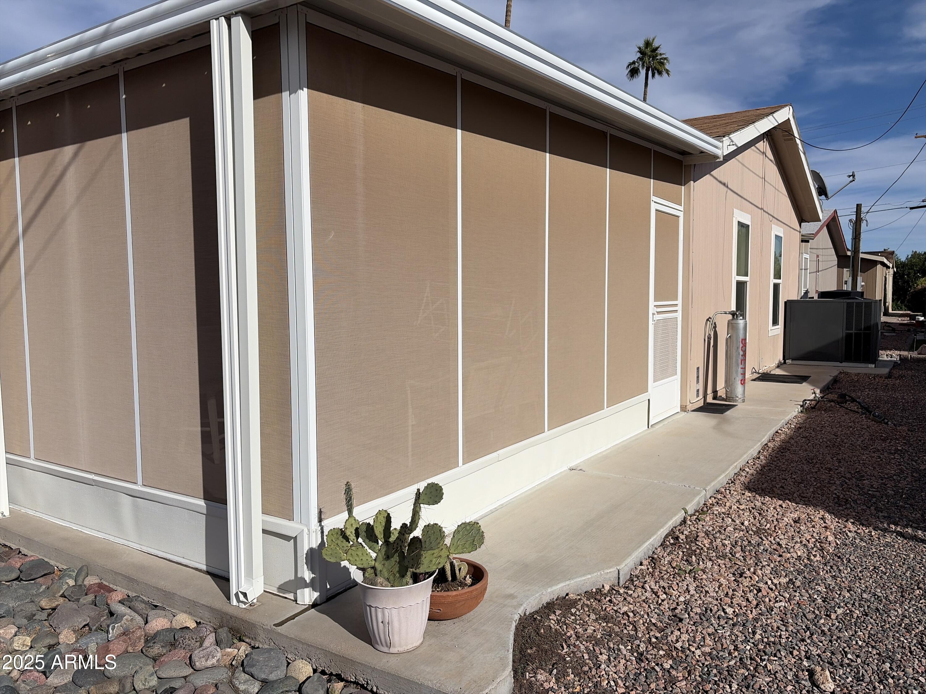 2929 East Main Street, Unit 43 Mesa, AZ 85213 - Photo 7 of 36 a view of a house with a potted plant