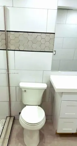 a bathroom with a toilet and a sink
