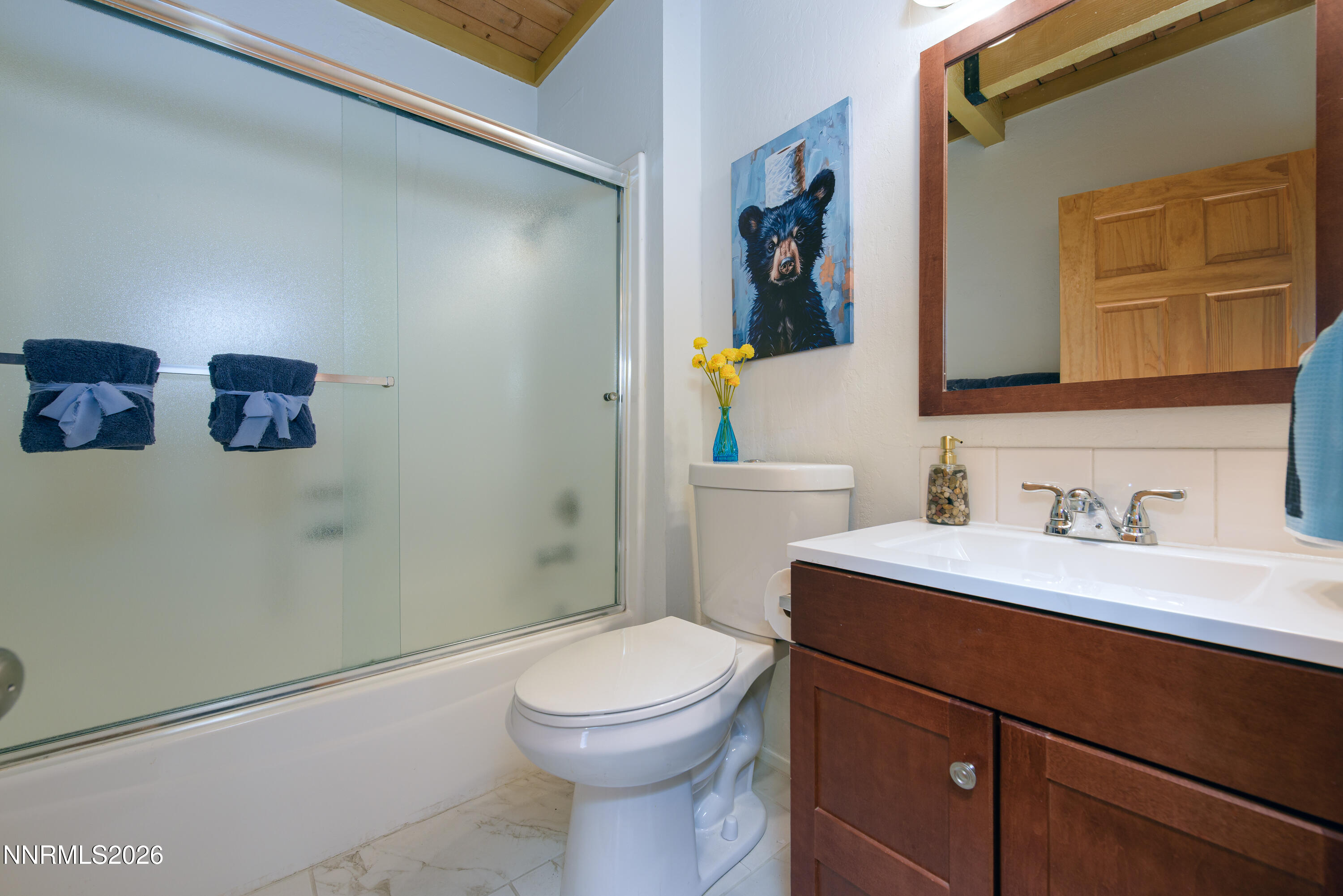 111 Tramway Drive, Unit 5 Stateline, NV 89449 - Photo 11 of 24 a bathroom with a toilet a sink a vanity and mirror