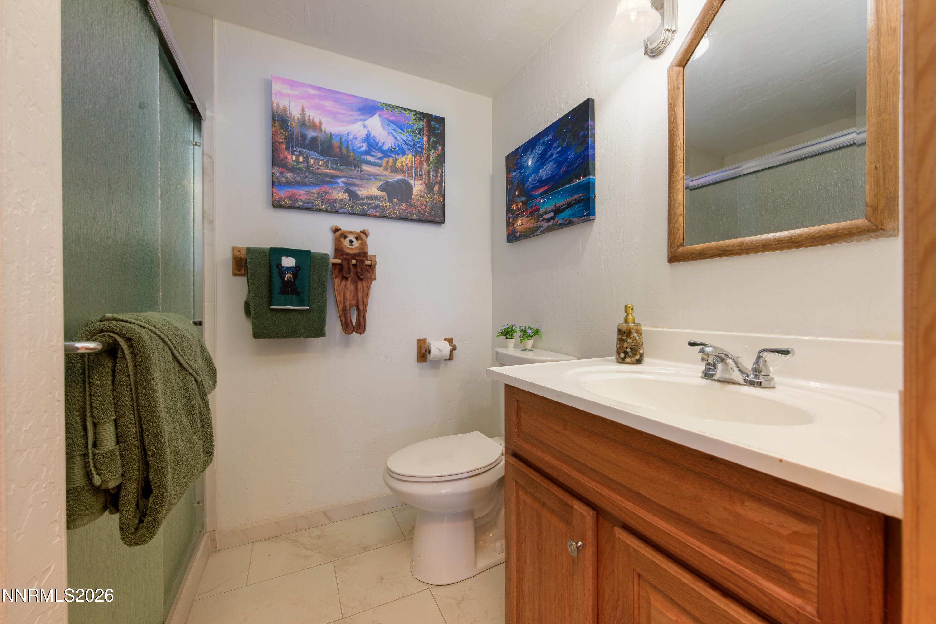 111 Tramway Drive, Unit 5 Stateline, NV 89449 - Photo 14 of 24 a bathroom with a granite countertop sink a toilet and a mirror