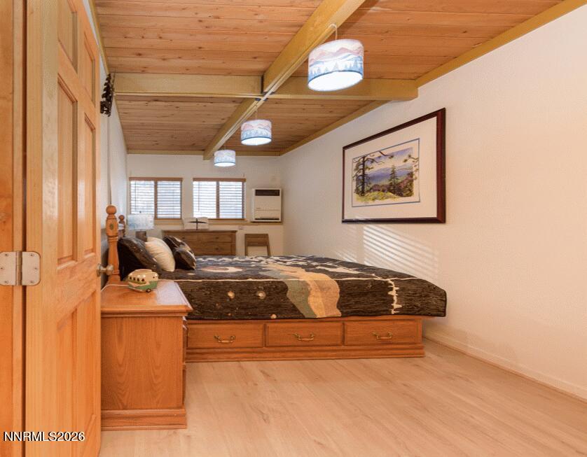 111 Tramway Drive, Unit 5 Stateline, NV 89449 - Photo 4 of 24 a bedroom with a bed and window