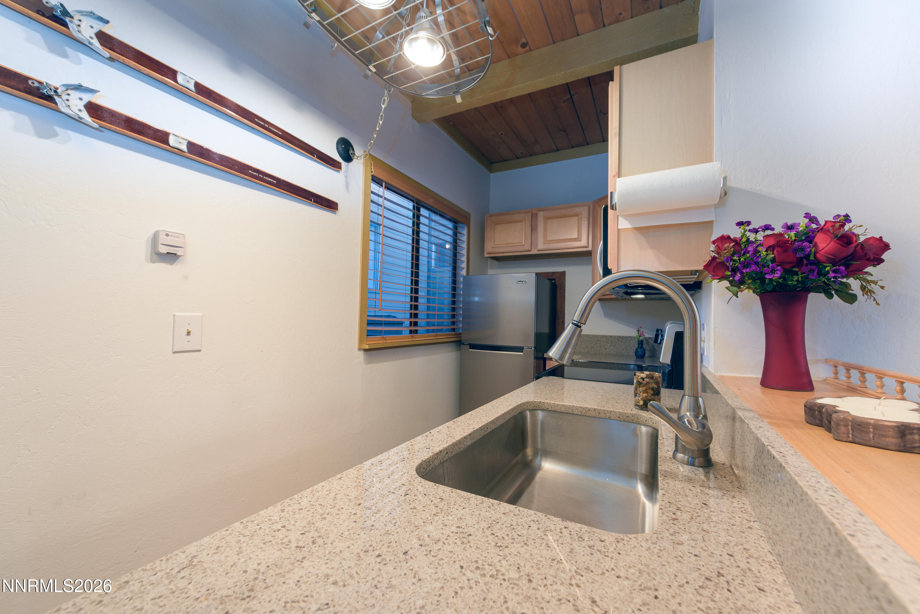 111 Tramway Drive, Unit 5 Stateline, NV 89449 - Photo 8 of 24 a kitchen with a sink cabinets and a potted plant