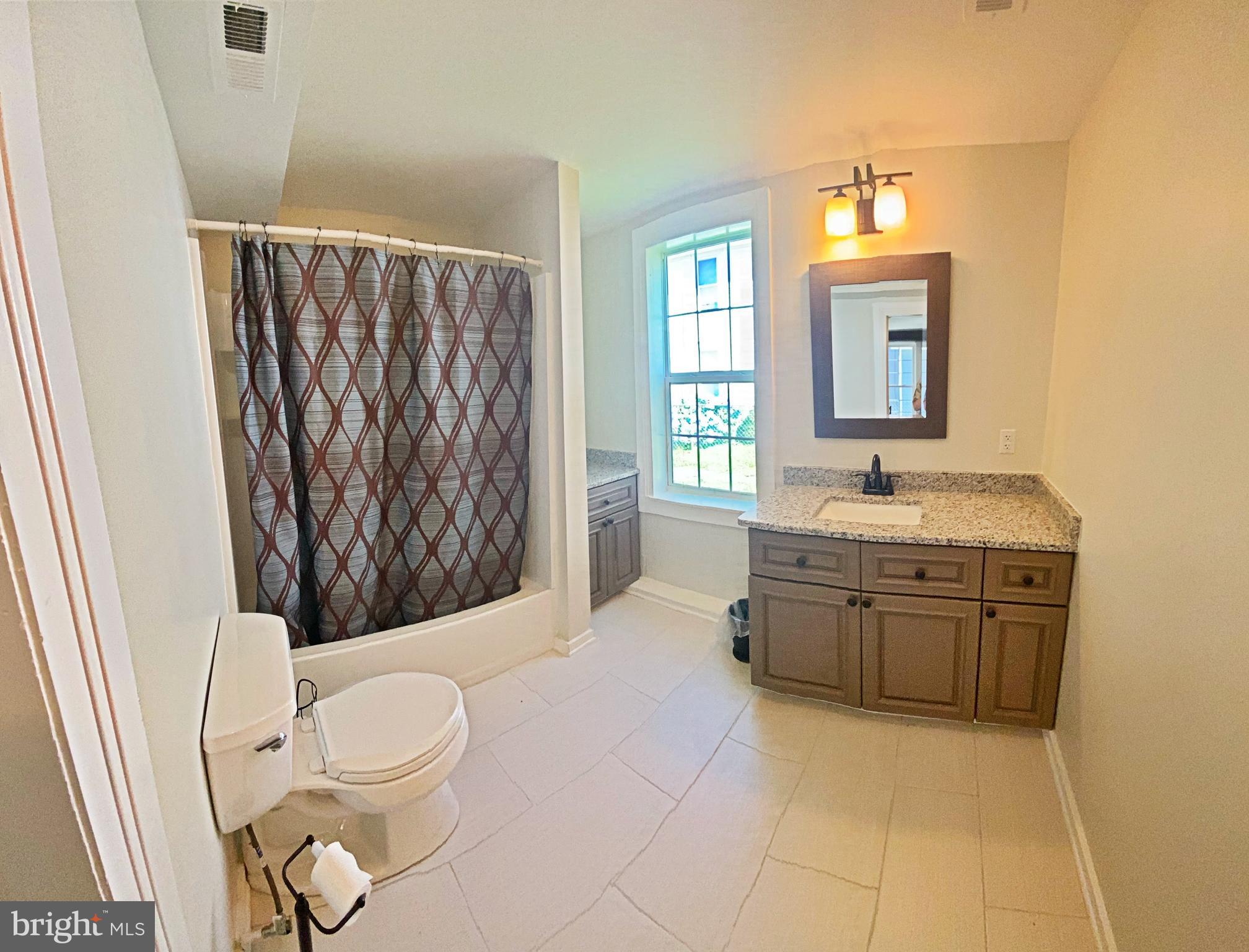 203 Caroline Avenue Ridgely, MD 21660 - Photo 17 of 30 Downstairs Bathroom with Tub & Shower