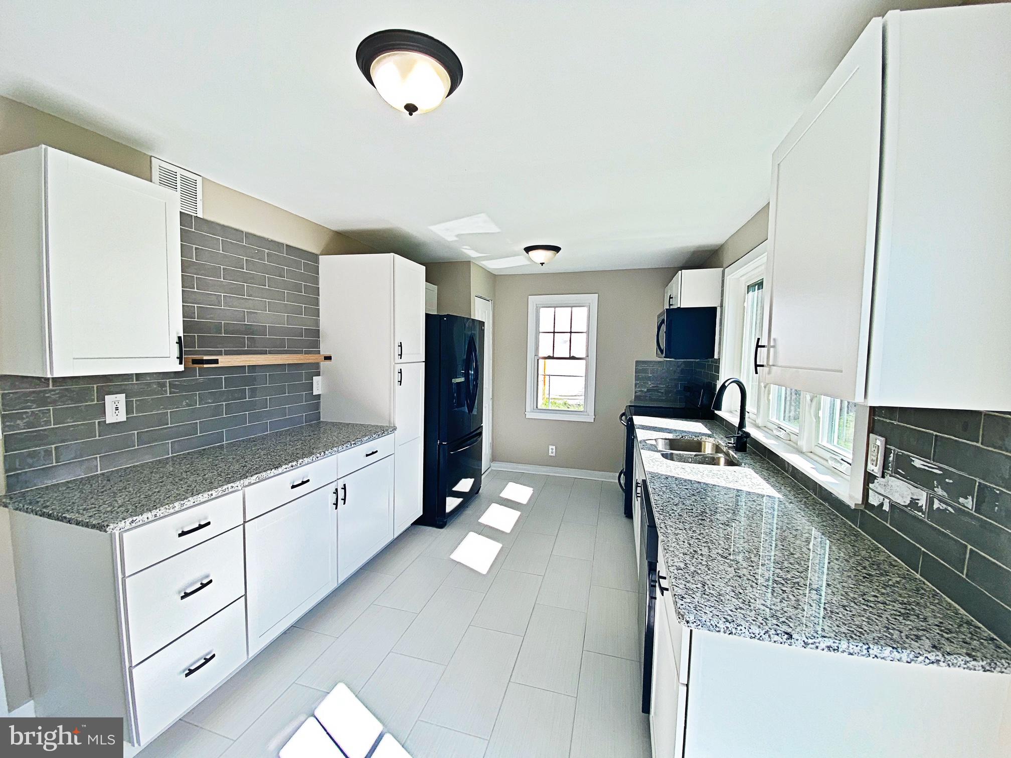 203 Caroline Avenue Ridgely, MD 21660 - Photo 20 of 30 Kitchen with Tile Back Splash
