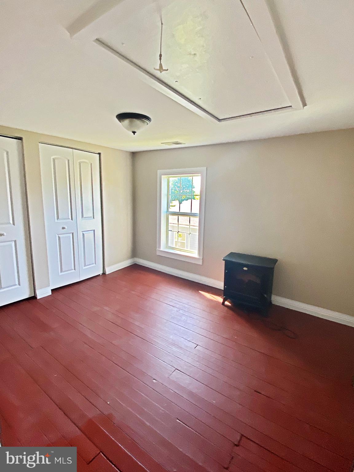 203 Caroline Avenue Ridgely, MD 21660 - Photo 22 of 30 Spacious Second Bedroom w/ Attic Pull Down
