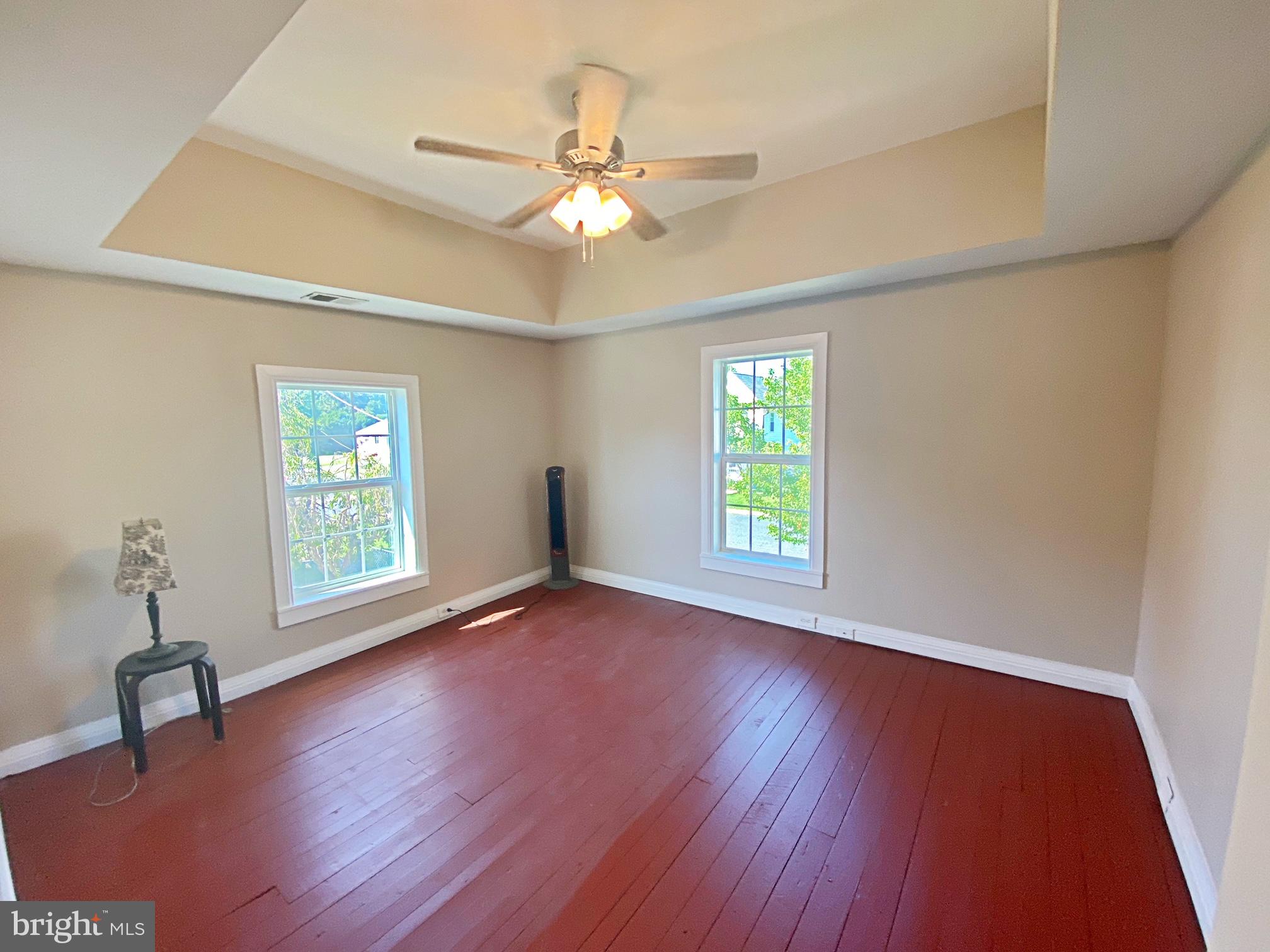 203 Caroline Avenue Ridgely, MD 21660 - Photo 25 of 30 Primary Bedroom w/ Tray Ceiling and Ceiling Fan