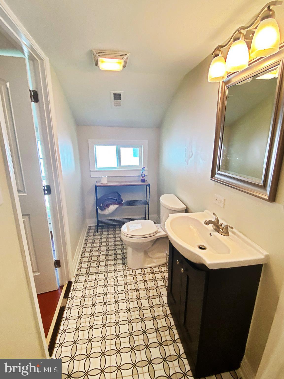 203 Caroline Avenue Ridgely, MD 21660 - Photo 29 of 30 Upstairs Bathroom with Accent Vinyl Flooring