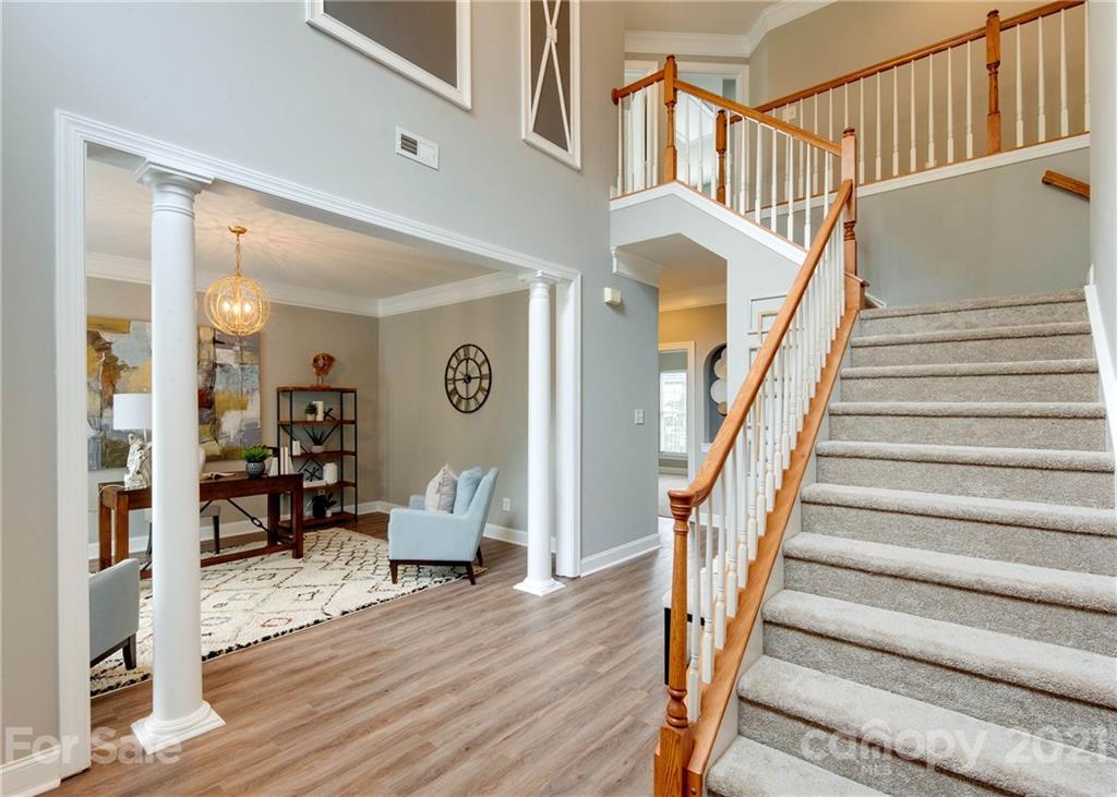 2314 Mermans Road Charlotte, NC 28270 - Photo 2 of 45 a view of entryway and hall with wooden floor
