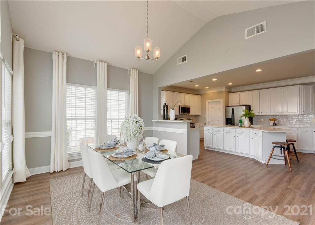 2314 Mermans Road Charlotte, NC 28270 - Photo 16 of 45 a view of a dining room with furniture window and wooden floor