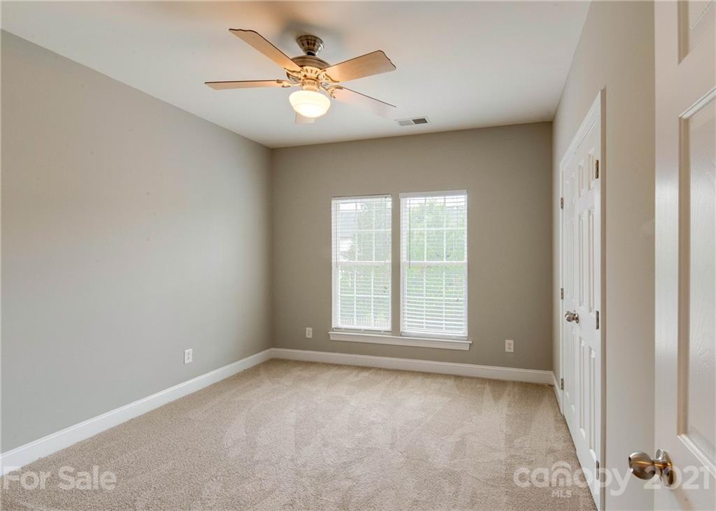 2314 Mermans Road Charlotte, NC 28270 - Photo 18 of 45 an empty room with windows and fan