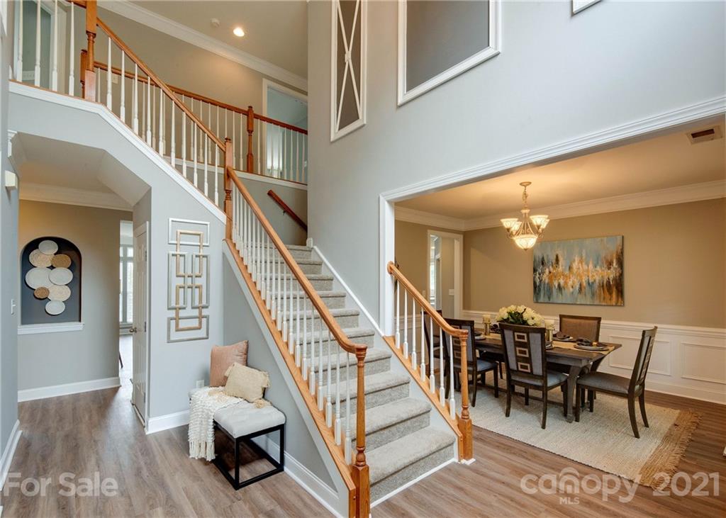 2314 Mermans Road Charlotte, NC 28270 - Photo 3 of 45 a view of a livingroom with furniture and stairs