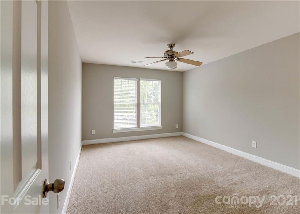 2314 Mermans Road Charlotte, NC 28270 - Photo 21 of 45 a view of room with a ceiling fan and window