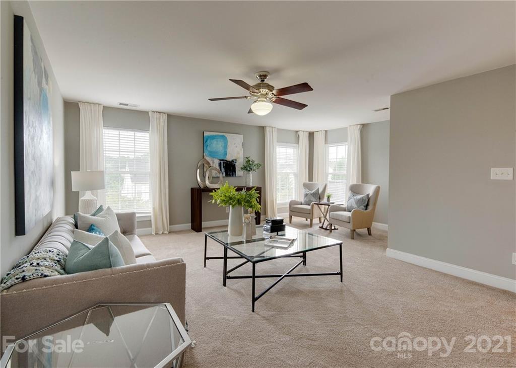 2314 Mermans Road Charlotte, NC 28270 - Photo 24 of 45 a living room with furniture and a potted plant