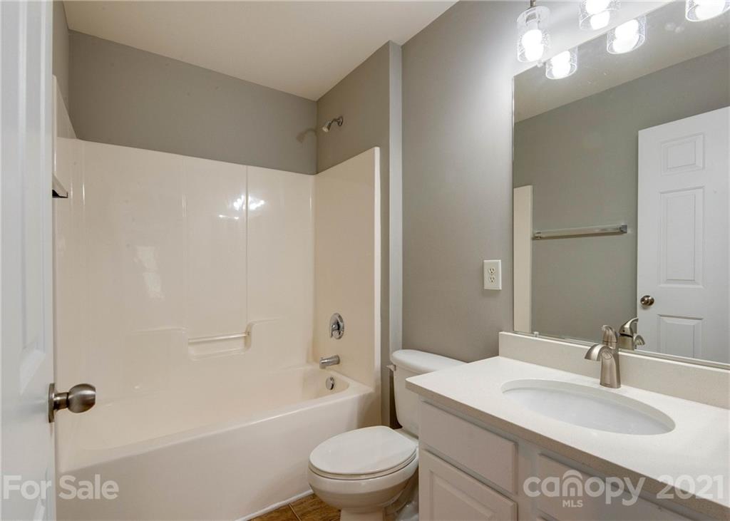 2314 Mermans Road Charlotte, NC 28270 - Photo 25 of 45 a bathroom with a sink a toilet and shower