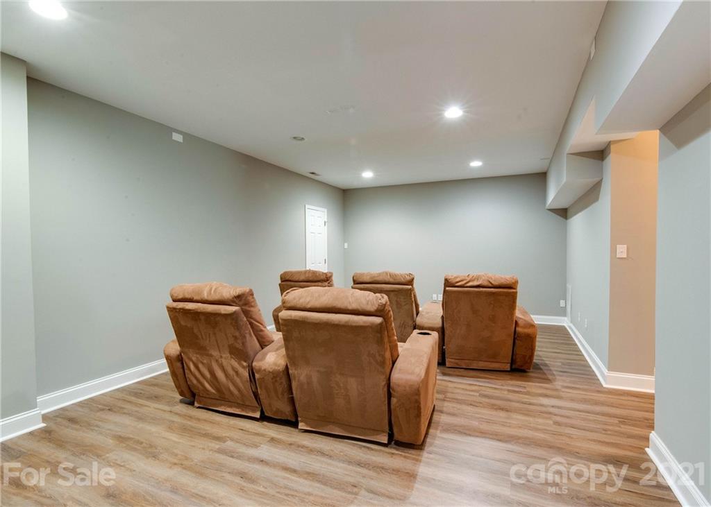 2314 Mermans Road Charlotte, NC 28270 - Photo 39 of 45 a room with wooden floor and furniture