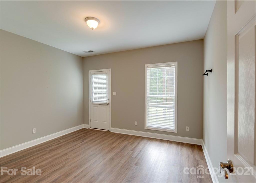 2314 Mermans Road Charlotte, NC 28270 - Photo 40 of 45 a view of an empty room with wooden floor and a window