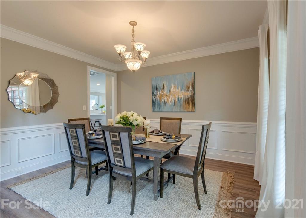 2314 Mermans Road Charlotte, NC 28270 - Photo 5 of 45 a view of a dining room with furniture and chandelier