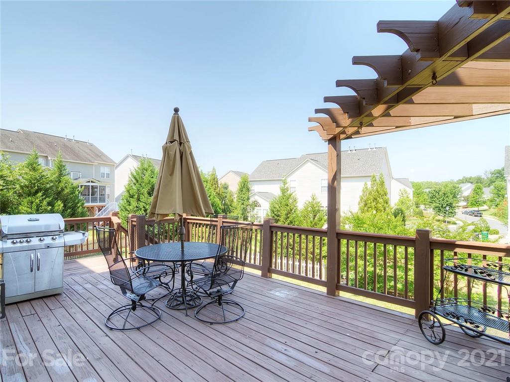 2314 Mermans Road Charlotte, NC 28270 - Photo 42 of 45 a view of a chairs and table on the deck