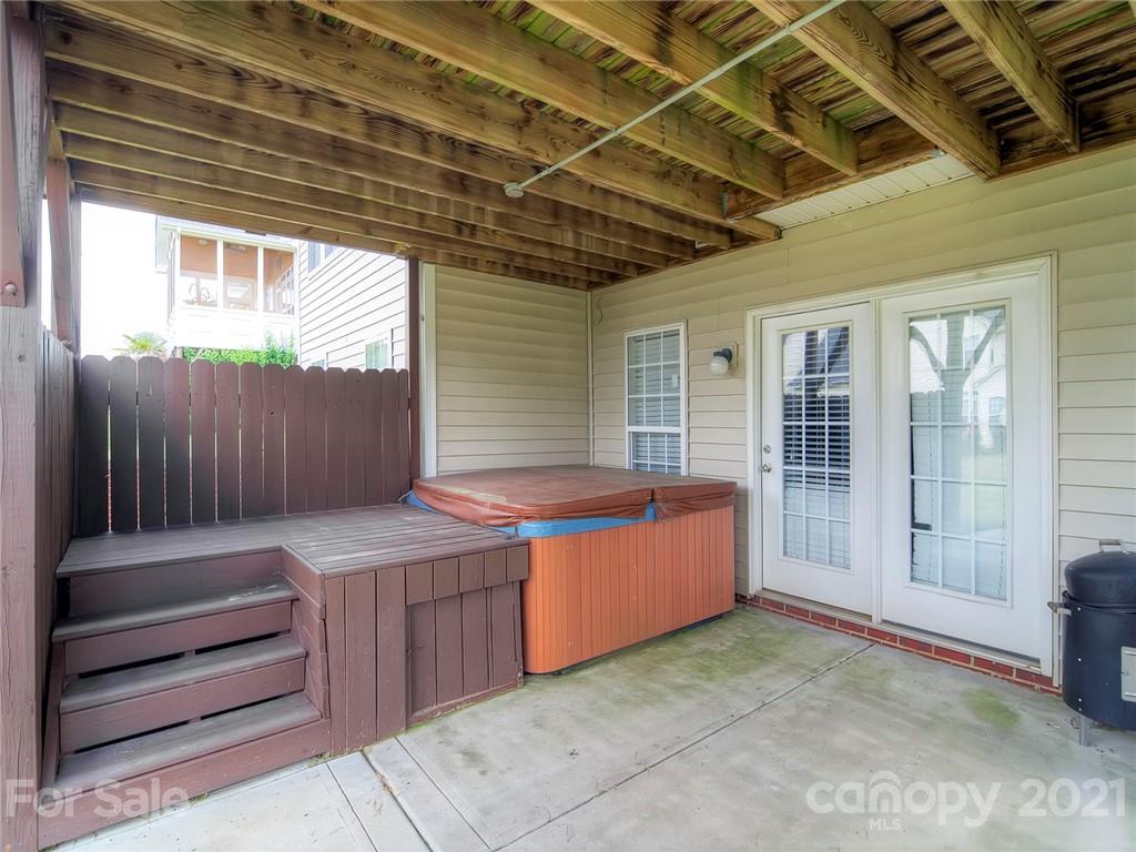 2314 Mermans Road Charlotte, NC 28270 - Photo 43 of 45 a view of a backyard with a tub and wooden fence