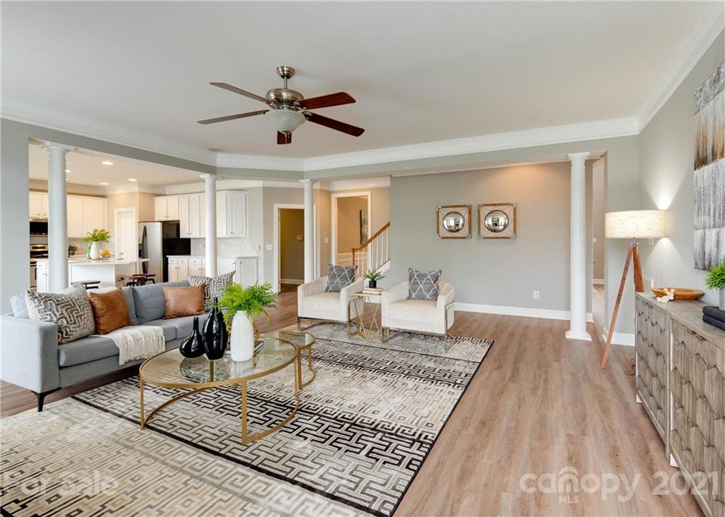 2314 Mermans Road Charlotte, NC 28270 - Photo 8 of 45 a living room with furniture and a rug