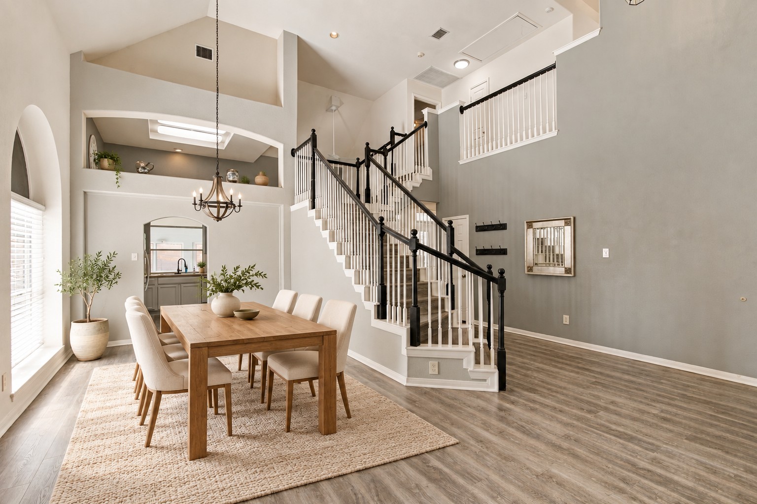910 Point Run Drive Pflugerville, TX 78660 - Photo 3 of 39 High ceilings and a prominent staircase define this airy, open dining area.
