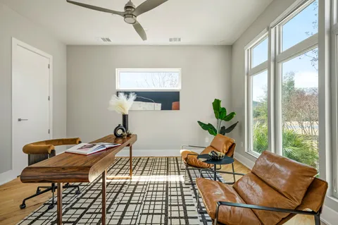 a workspace with furniture and a potted plant
