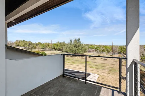 a view of a balcony with an outdoor space