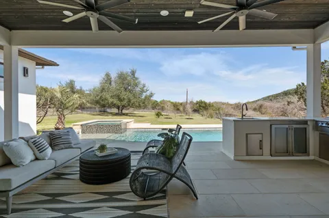 a view of a terrace with hardwood floor and a garden