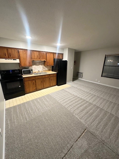 101 East Gray Street, Unit 3 Gallatin, TN 37066 - Photo 2 of 9 a large kitchen with kitchen island granite countertop a sink and stainless steel appliances
