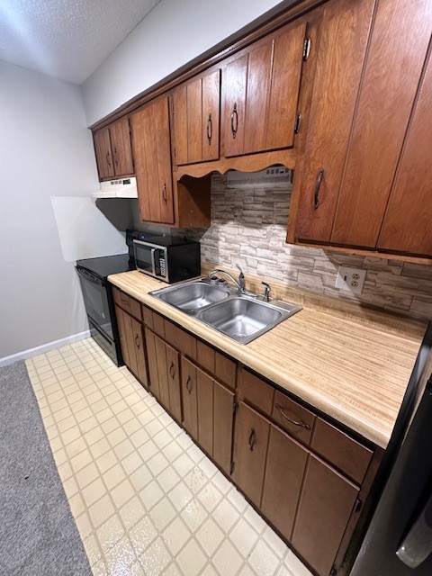 101 East Gray Street, Unit 3 Gallatin, TN 37066 - Photo 3 of 9 a kitchen with stainless steel appliances kitchen island granite countertop a sink stove and cabinets