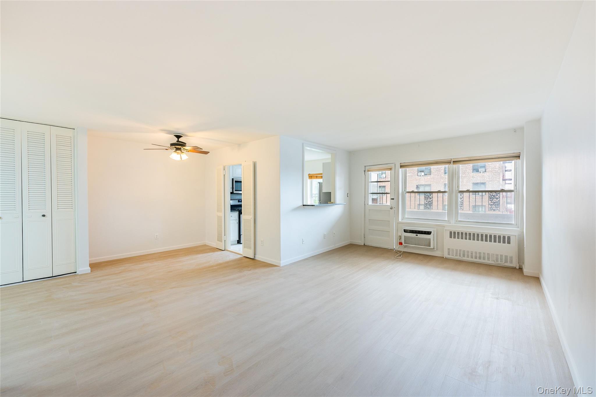 100-26 67th Road, Unit 4F Queens, NY 11375 - Photo 2 of 12 a view of an empty room with a fireplace
