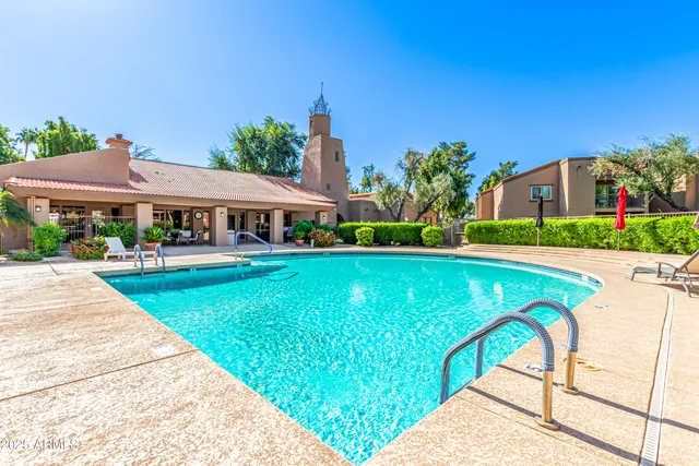 a view of swimming pool with outdoor seating and deck